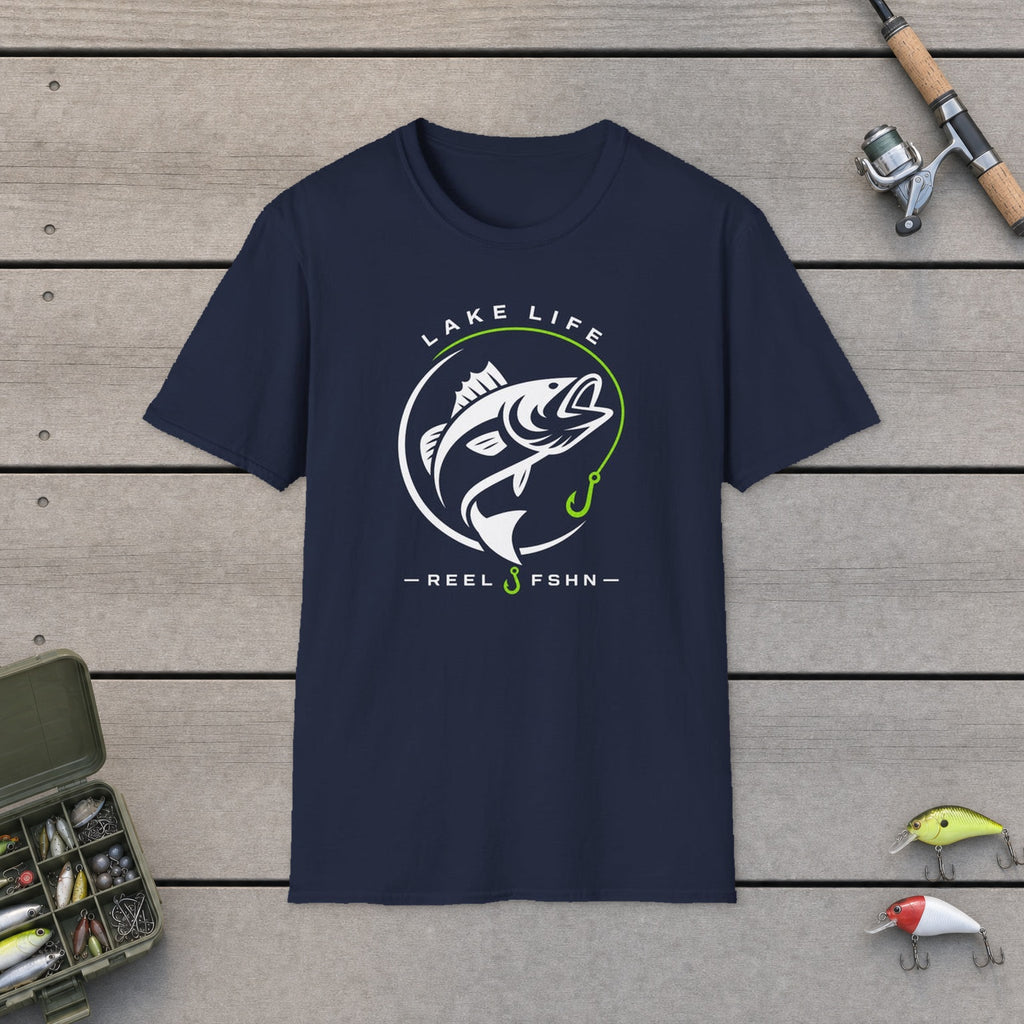 Lake Life T-Shirt flat-laid on wooden dock boards beside a fishing rod and tackle box