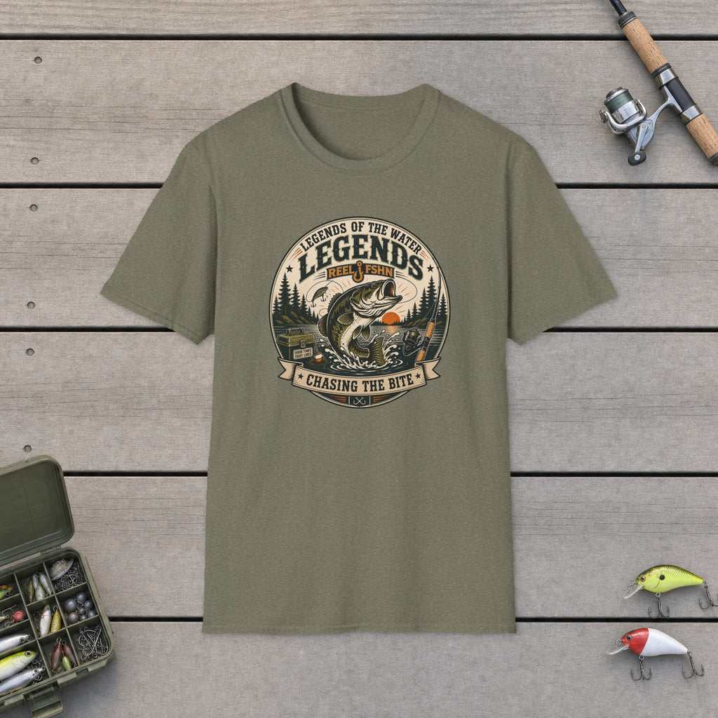 Legends Of The Water T-Shirt flat-laid on wooden dock boards beside a fishing rod and tackle box