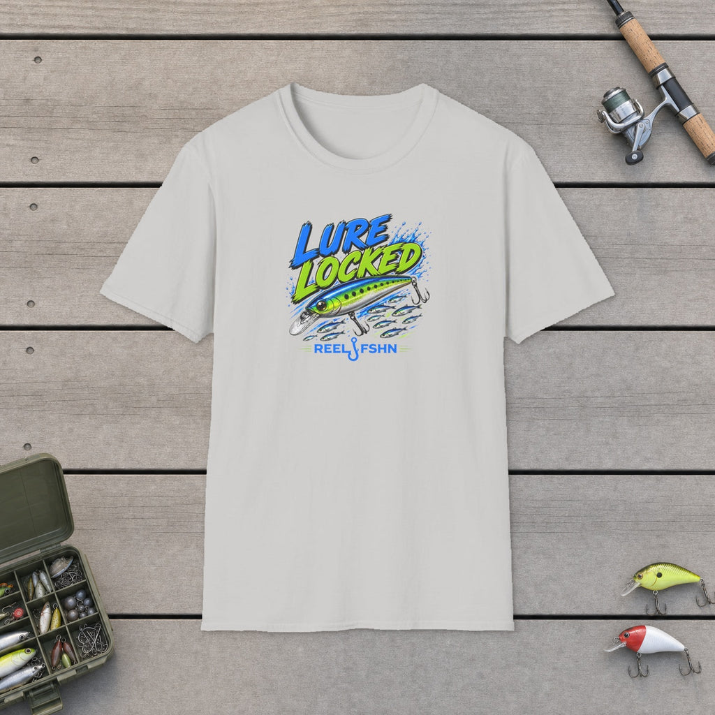 Lure Locked  T-Shirt flat-laid on wooden dock boards beside a fishing rod and tackle box