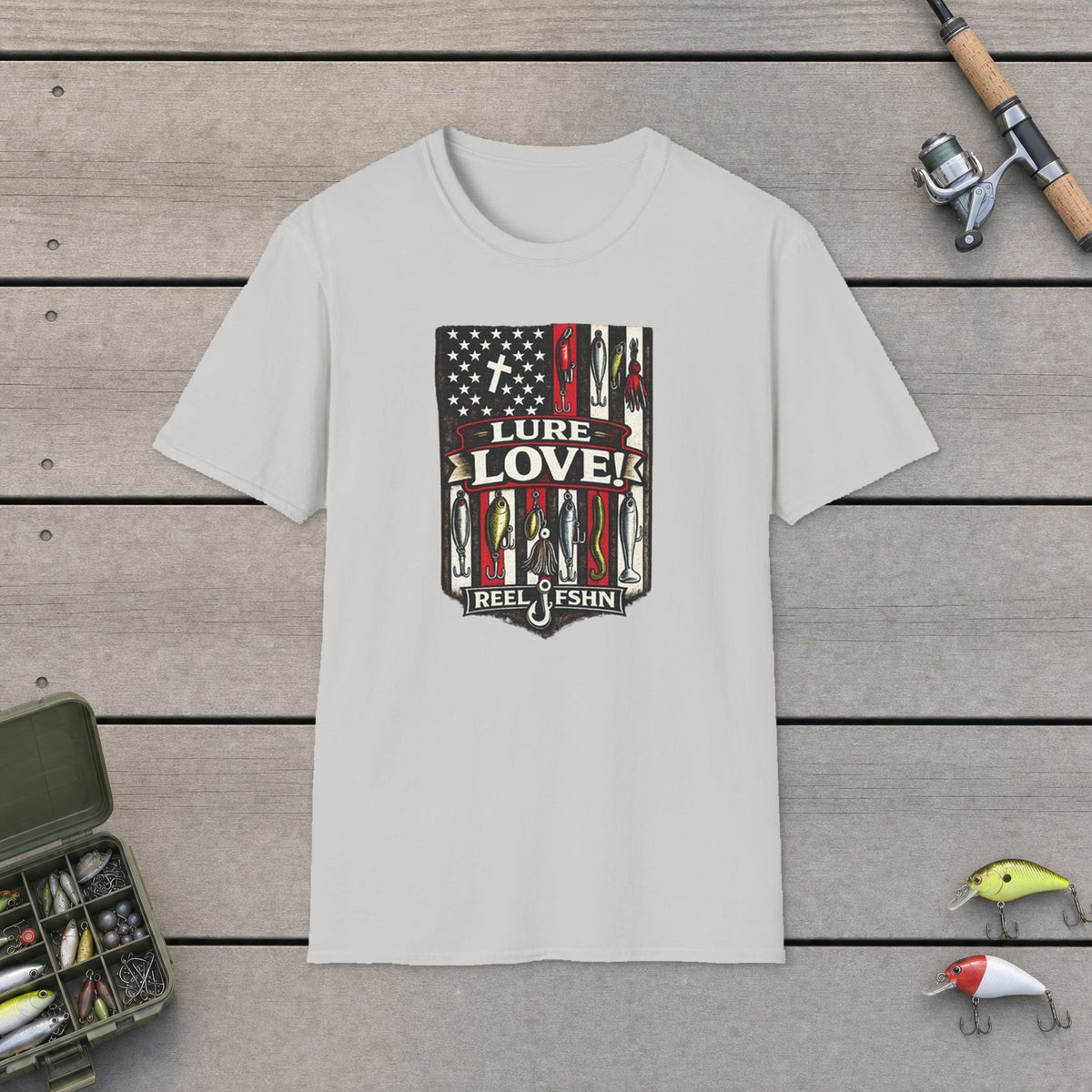 Lure Love! T-Shirt on a wooden dock with fishing rod, reel, tackle box and lures