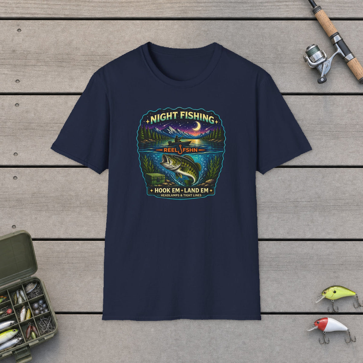 Night Fishing  T-Shirt on a wooden dock with fishing rod, reel, tackle box and lures