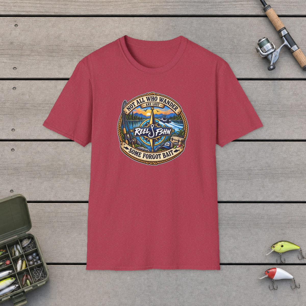 Not All Who Wander Are Lost T-Shirt on a wooden dock with fishing rod, reel, tackle box and lures
