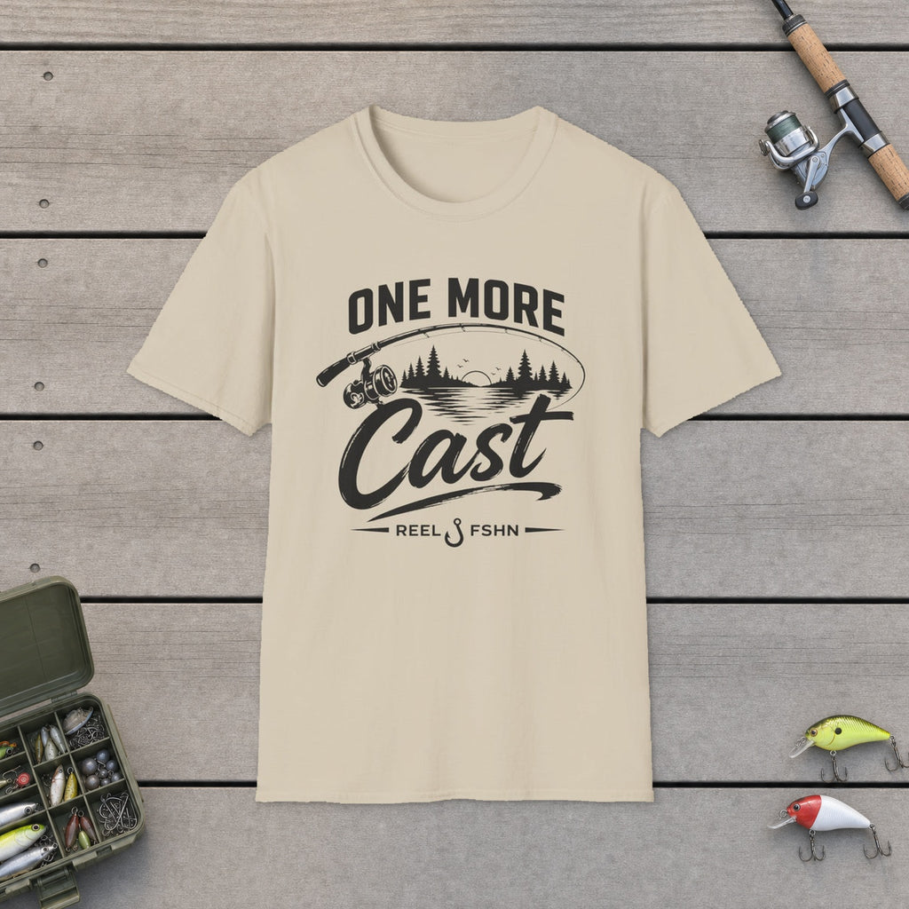 One More Cast  T-Shirt flat-laid on wooden dock boards beside a fishing rod and tackle box