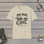 One More Cast  T-Shirt on a wooden dock with fishing rod, reel, tackle box and lures