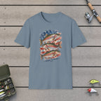 Patriotic Trouts T-Shirt on a wooden dock with fishing rod, reel, tackle box and lures