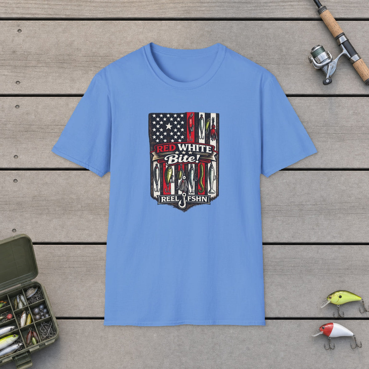Red, White, Bite! T-Shirt on a wooden dock with fishing rod, reel, tackle box and lures