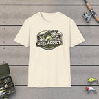 Reel Addict Can't Stop Casting T-Shirt on a wooden dock with fishing rod, reel, tackle box and lures
