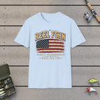 REEL FSHN Built On Memories Made For Life T-Shirt on a wooden dock with fishing rod, reel, tackle box and lures