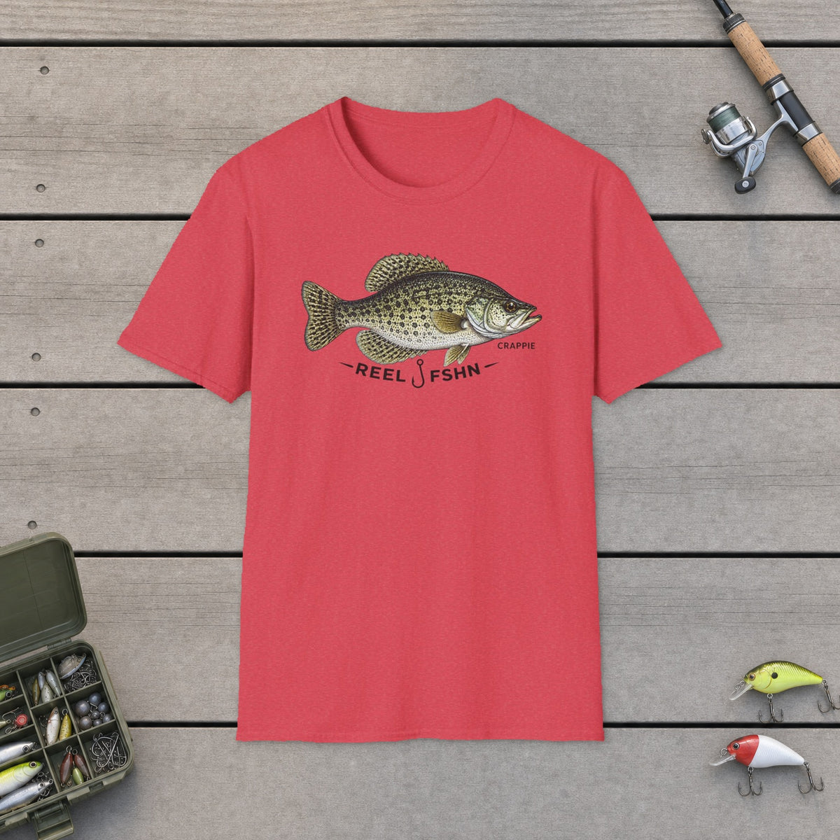 REEL FSHN CRAPPIE T-Shirt on a wooden dock with fishing rod, reel, tackle box and lures