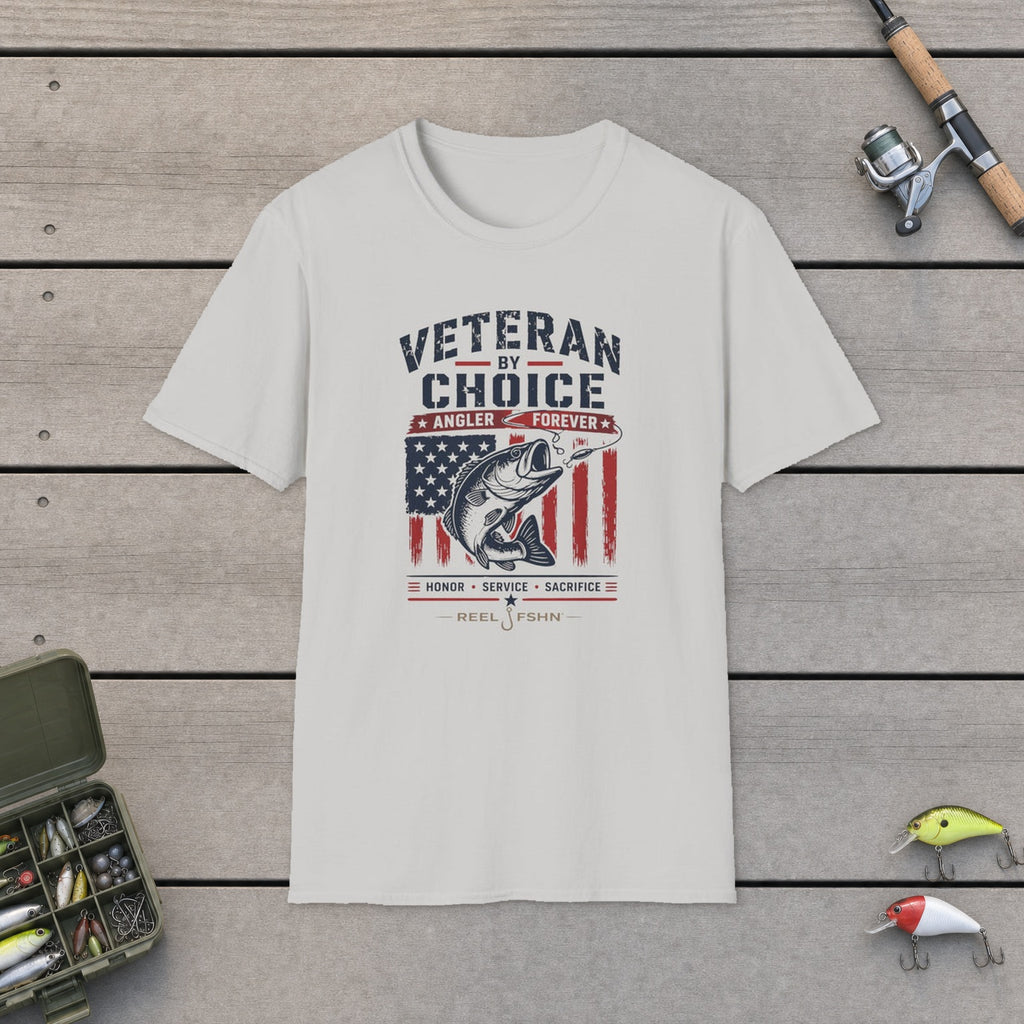 Veteran By Choice Angler Forever T-Shirt flat-laid on wooden dock boards beside a fishing rod and tackle box