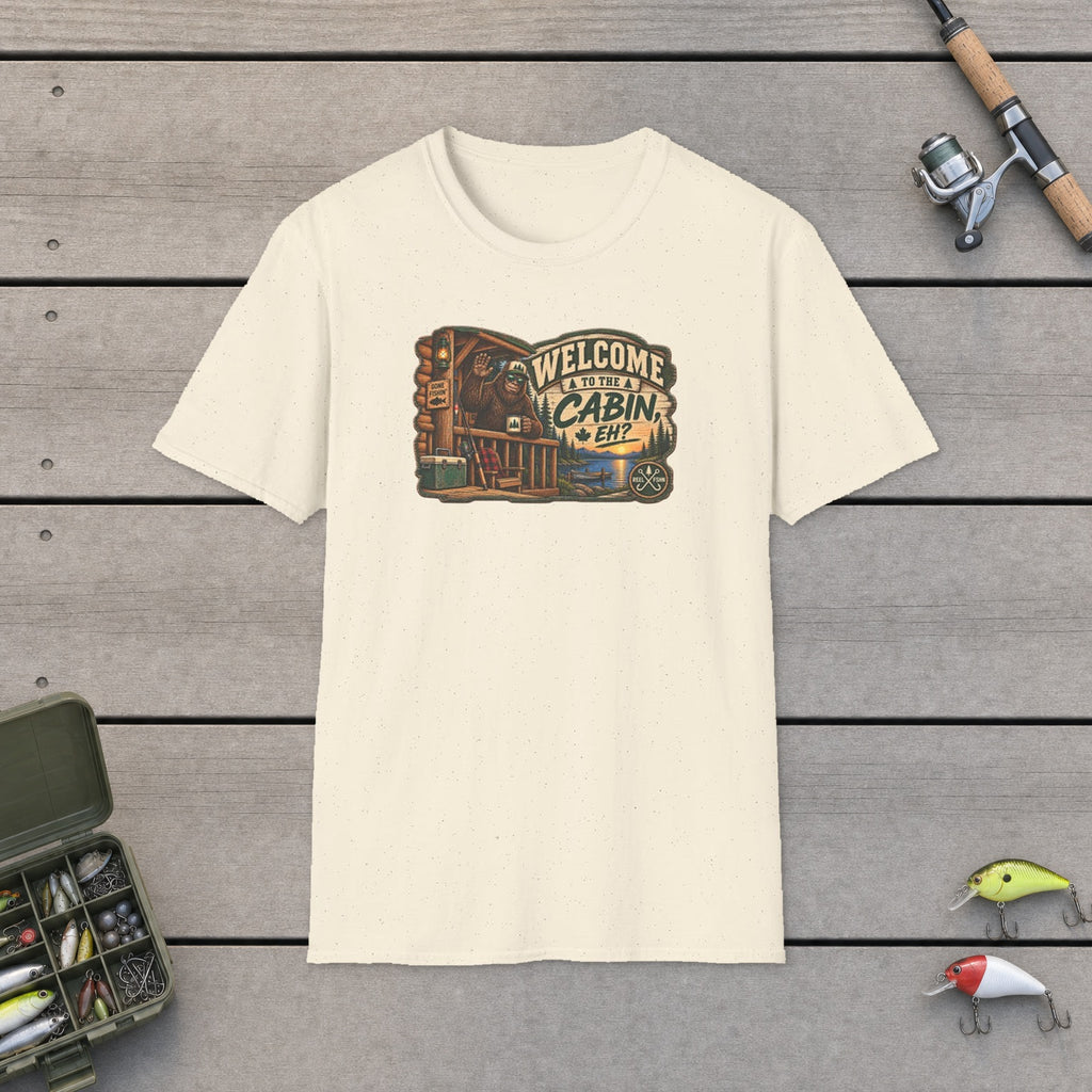 Welcome To The Cabin, EH? T-Shirt flat-laid on wooden dock boards beside a fishing rod and tackle box