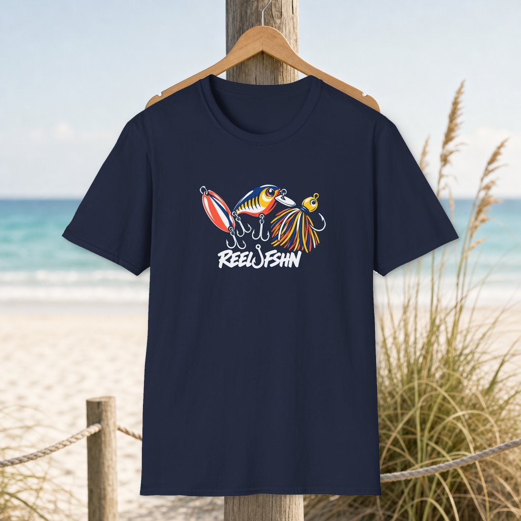 Trio Of Lures T-Shirt on a hanger beside a sandy beach and turquoise coastal water