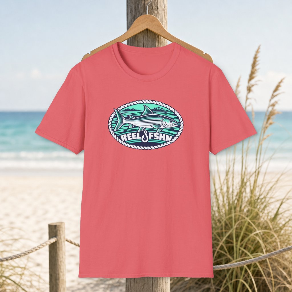 Bonefish Navy & Seafoam T-Shirt on a hanger beside a sandy beach and turquoise coastal water